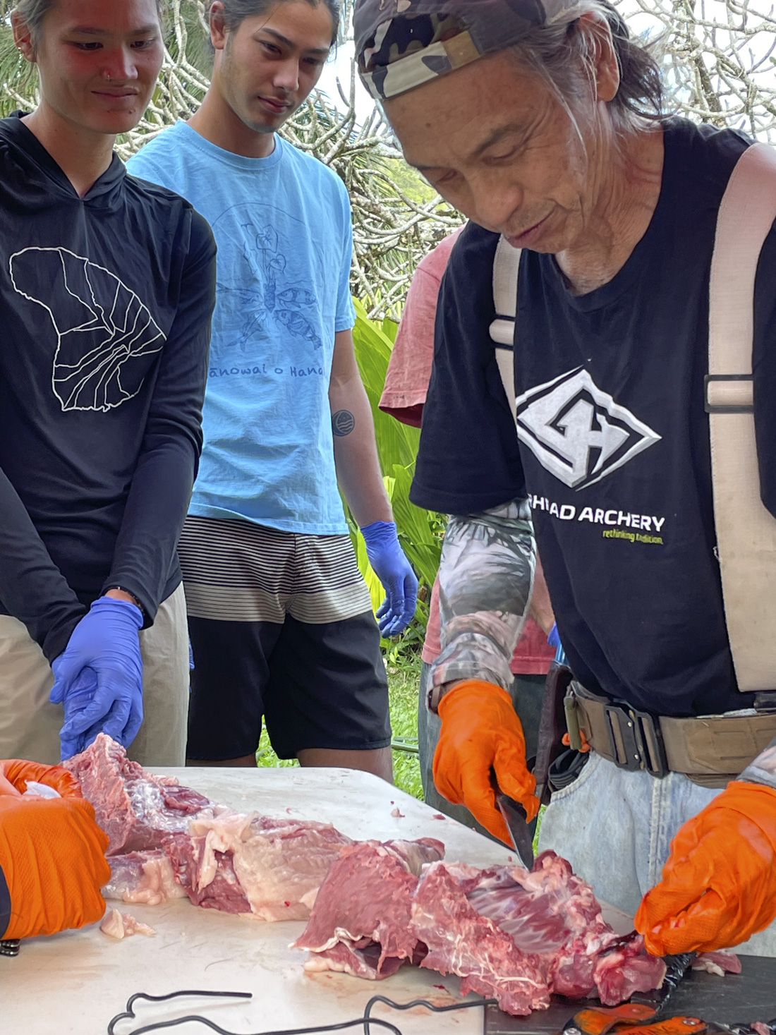 Doug leading wild pig butchery class in 2024